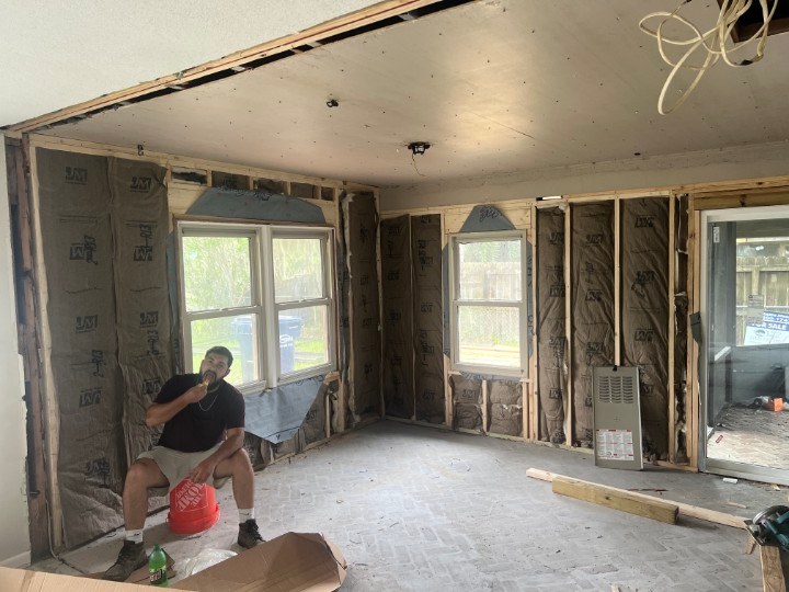 Before — Waverly GA interior taken back to studs Waverly GA home interior stripped to bare studs with exposed insulation and wiring before the whole-home renovation
